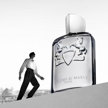 Parfums de Marly campaign — a man walking beside the signature bottle